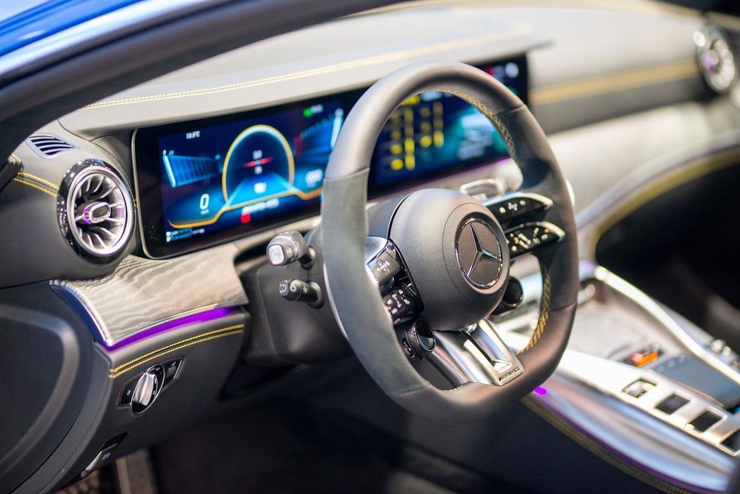 a-car-dashboard-with-a-steering-wheel-and-a-dash-board-j3qflr5hxh4